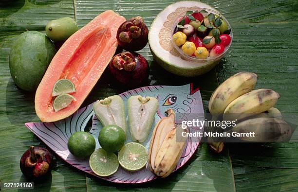 tropical fruits cut to display their flesh - michelle flesh stock pictures, royalty-free photos & images