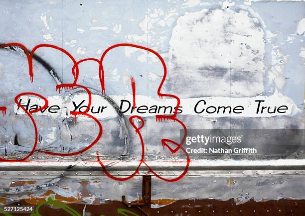 "have your dreams come true" sign on abandoned rail car - dreams come true concept inspirational photos et images de collection