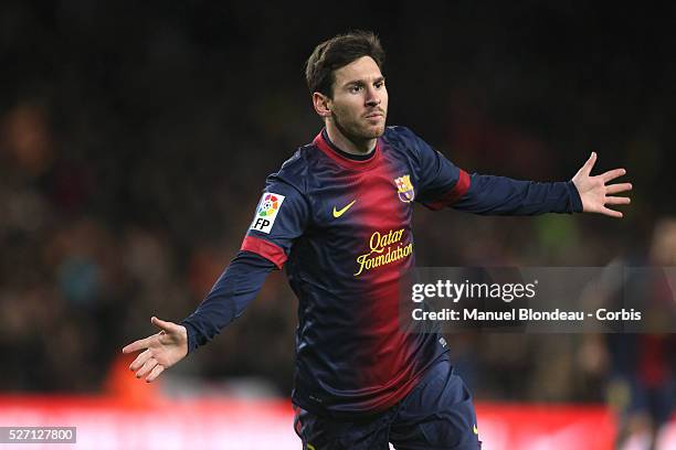 Lionel Messi of FC Barcelona celebrates after scoring his sides third goal during the Spanish league football match between FC Barcelona and Atletico...
