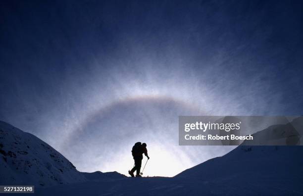 skitouring - skier silhouette stock pictures, royalty-free photos & images
