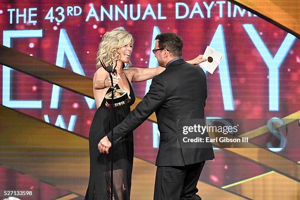 Actress Laura Wright presents Emmy award for Outstanding Lead Actor in a Drama to Actor Tyler Christopher onstage at the 43rd Annual Daytime Emmy...
