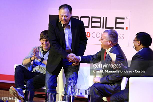 Peter Chou, chief executive officer of HTC and Stephen Elop,chief executive officer of Nokia are shaking hands during a keynote event at the Mobile...