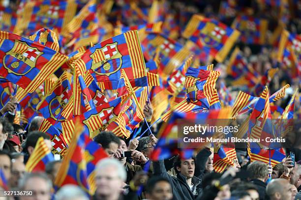 Supporters wave a flag of FC Barcelona during the UEFA Champions league Round of 16 second leg football match between FC Barcelona and Manchester...