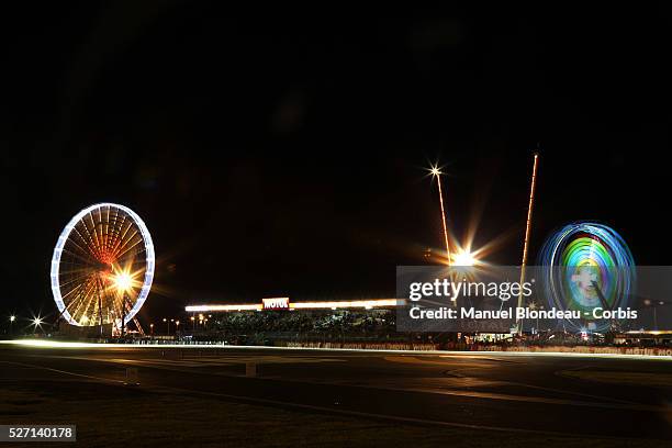 World Endurance Championship 2013 - General view - Cars drive along the Ferris Wheel and spectator grandstand during the 90th 24-hour Le Mans...