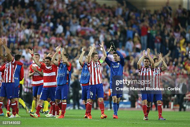 Players of Club Atletico de Madrid celebrate after their victory at the end of the UEFA Champions league Quarter Final second leg football match...