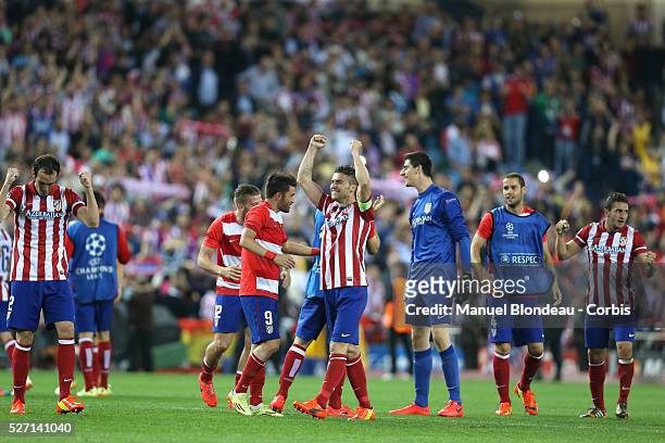 Players of Club Atletico de Madrid celebrate after their victory at the end of the UEFA Champions league Quarter Final second leg football match...