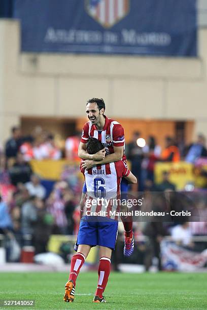 Juanfran and of Club Atletico de Madrid celebrate after their victory at the end of the UEFA Champions league Quarter Final second leg football match...