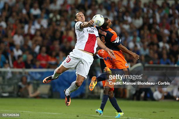 Zlatan Ibrahimovic of Paris Saint Germain Duels for the ball with Hilton of Montpellier HSC during the French Ligue 1 Championship football match...