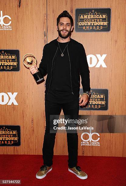 Singer Thomas Rhett poses in the press room at the 2016 American Country Countdown Awards at The Forum on May 01, 2016 in Inglewood, California.