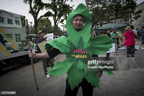 Hundreds of people join in a march calling for the legalization of marijuana in Tokyo, May 1, 2016. People participated in the march calling for the...