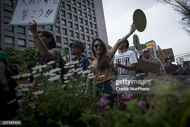 Hundreds of people join in a march calling for the legalization of marijuana in Tokyo, May 1, 2016. People participated in the march calling for the...