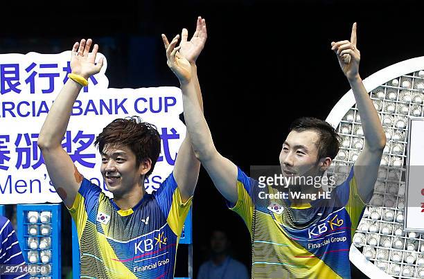 Gold medalists Lee Yong Dae and Yoo Yeon Seong of South Korea attend the award ceremony of the men's doubles final at the 2016 Badminton Asia...
