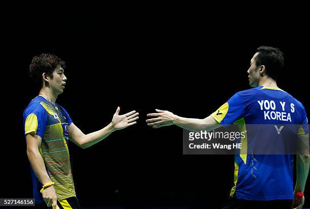Korea's Lee Yong Dae and Yoo Yeon Seong react during the men's doubles final match against Li Junhui and Liu Yuchen of China during their men's...