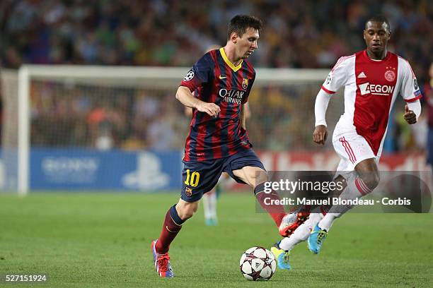 Lionel Messi of FC Barcelona runs with the ball during the UEFA Champions league football match between FC Barcelona and Ajax Amsterdam at the Camp...