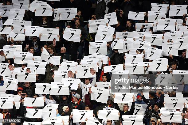 Fans of Real Madrid display posters with the number 7 of Portuguese forward Cristiano Ronaldo in support of his candidancy for the Golden Ball 2013...