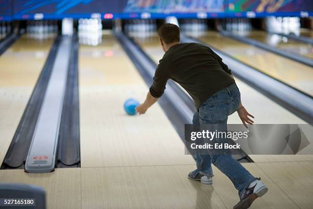 young man bowling - ten pin bowling foto e immagini stock