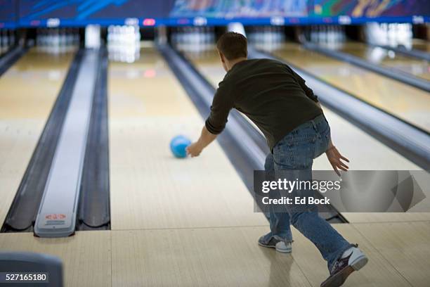 young man bowling - bowling stock pictures, royalty-free photos & images