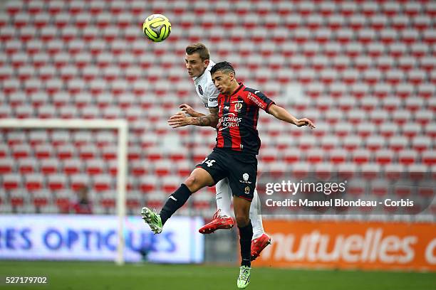 Lucas Digne of Paris SG jumps to win a header with Said Benrahma of OGC Nice during the French championship L1 football match between OGC Nice and...