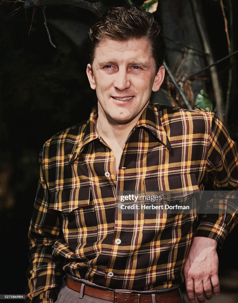 Kirk Douglas Wearing a Dress Shirt and Slacks