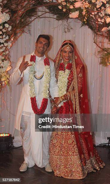 Bollywood couple Bipasha Basu and Karan Singh pose for shutterbugs after their wedding ceremony on April 30, 2016 in Mumbai, India. Bipasha Basu got...