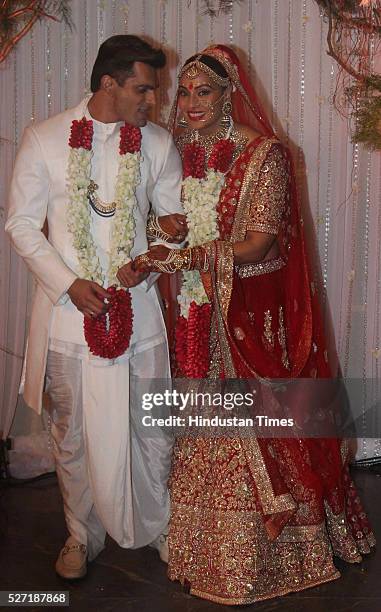 Bollywood couple Bipasha Basu and Karan Singh pose for shutterbugs after their wedding ceremony on April 30, 2016 in Mumbai, India. Bipasha Basu got...