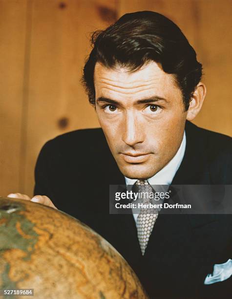 Gregory Peck Touching a Globe