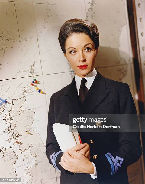 Dana Wynter portrays Anne Davis, a Royal Navy WREN and intelligence officer, in Sink the Bismarck! .