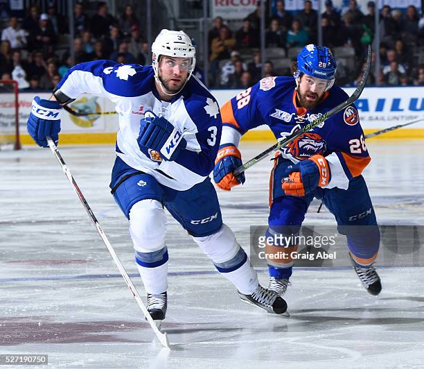 Brennan of the Toronto Marlies skates up ice against Mike Halmo of the Bridgeport Sound Tigers during AHL playoff game action on April 28 at Ricoh...