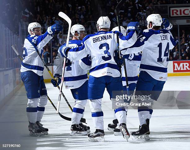 Brennan of the Toronto Marlies celebrates his goal with team mates against the Bridgeport Sound Tigers during AHL playoff game action April 28 at...