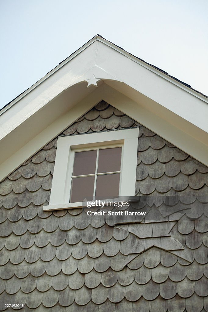 Attic window on a summer cottage