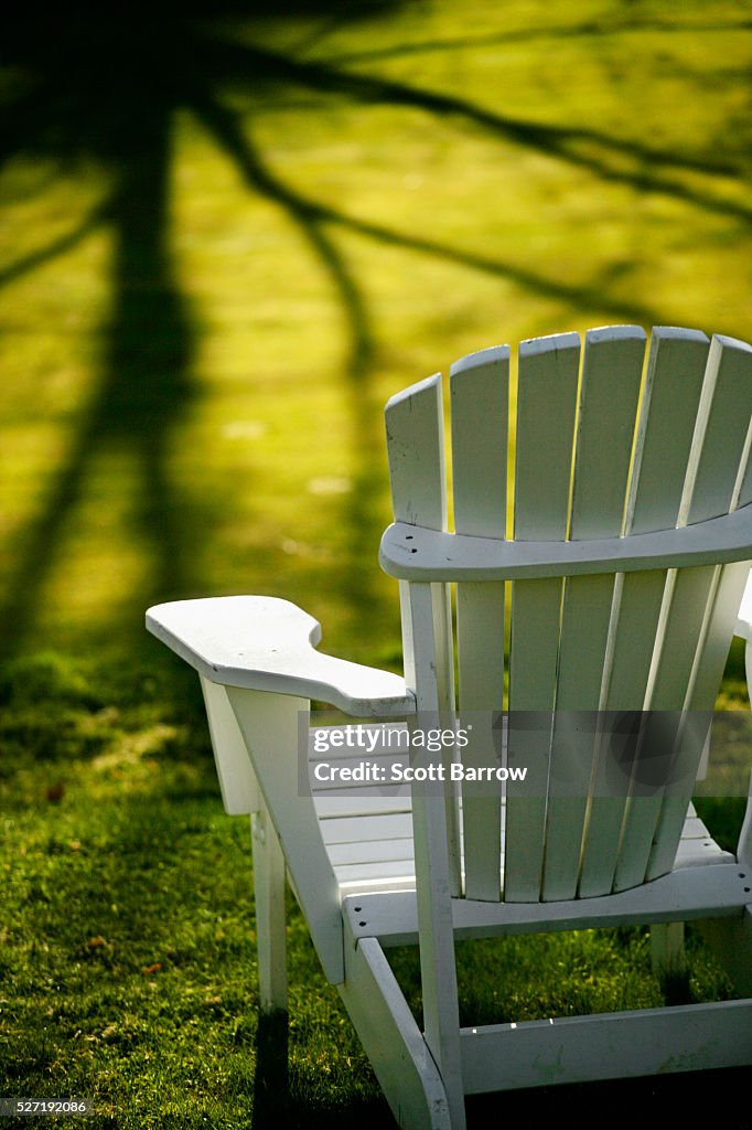 Adirondack chair in a sunny yard