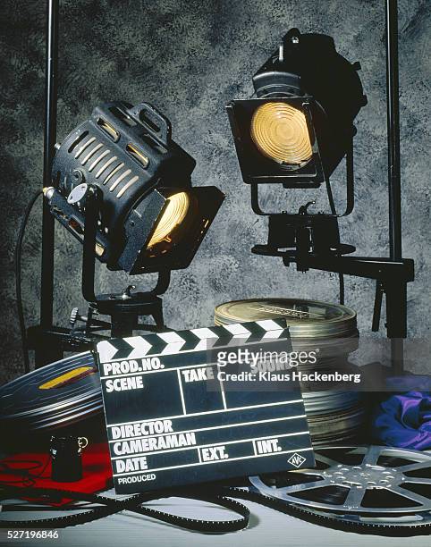 clapper board with headlights and film reels - clapboard stock pictures, royalty-free photos & images