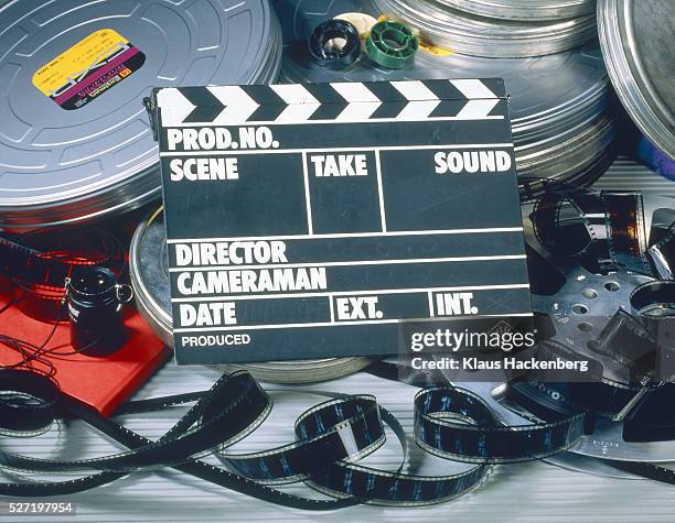 clapper board with film box and film - clapboard stock pictures, royalty-free photos & images