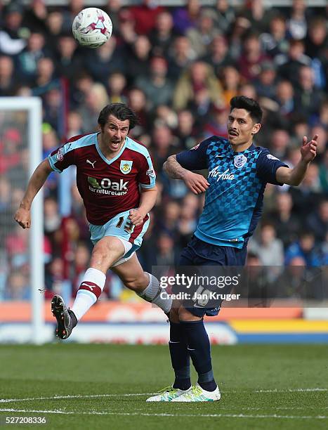 Joey Barton of Burnley beats Alejandro Faurlin of QPR to the ball during the Sky Bet Championship match between Burnley and Queens Park Rangers at...