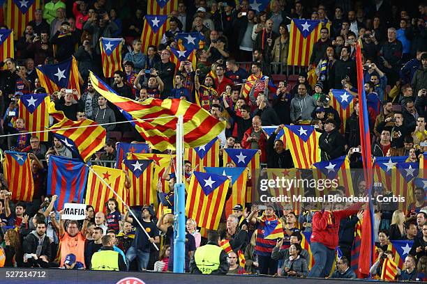 Fans of FC Barcelona wave "Esteladas" to protest against UEFA who have twice fined The FC Barcelona for letting fans fly the flag at matches, during...