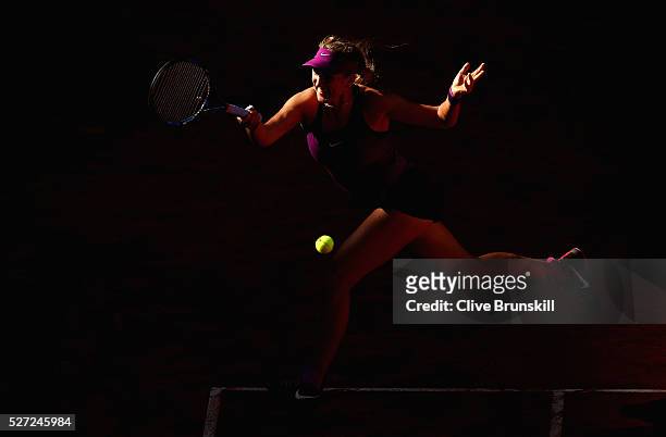 Victoria Azarenka of Belarus plays a forehand against Alize Cornet of France in their second round match during day three of the Mutua Madrid Open...