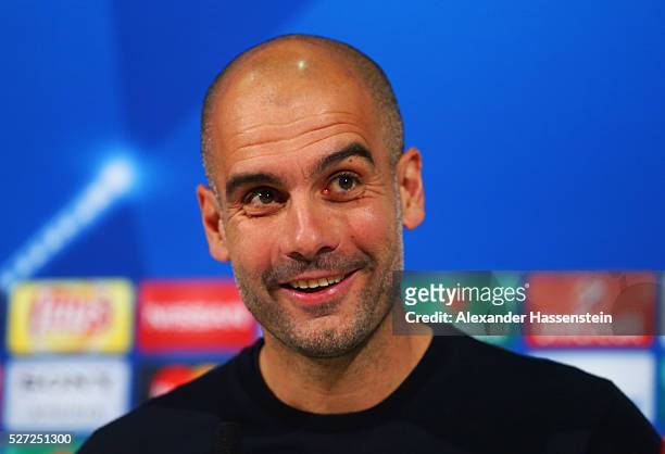 Josep Guardiola manager of Bayern Munich smiles during a FC Bayern Muenchen press conference ahead of their UEFA Champions League semi final second...