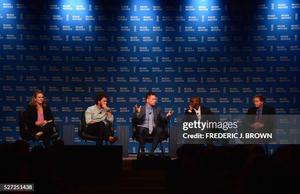 Moderator Josh Barro poses questions to participants in the panel "Leaders of Companies that are Changing the World" are represented at the 2016...