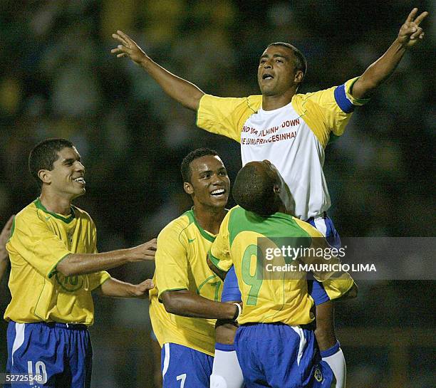 Brazil soccer star Romario celebrates his goal with his teammates in a friendly match against Guatemala in his retiring homage 27 April, 2005 at...