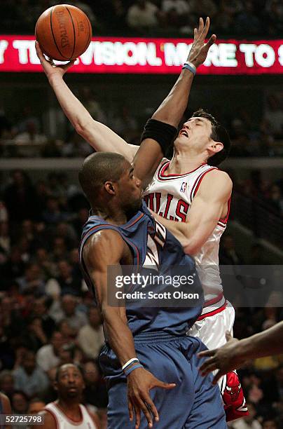 Kirk Hinrich of the Chicago Bulls attempts to shoot against Antawn Jamison of the Washington Wizards in Game two of the Eastern Conference...