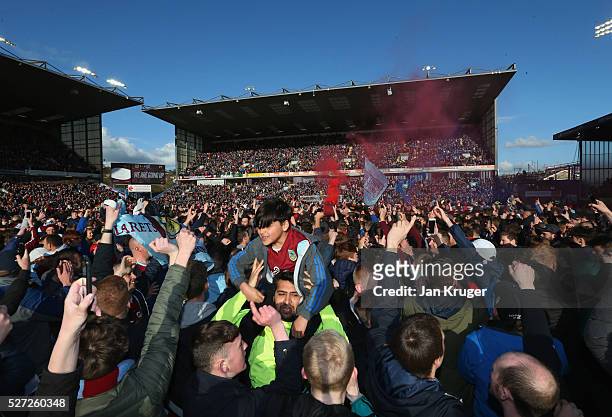Fans invade the pitch in celebration as Burnley are promoted to the Premier League after the Sky Bet Championship match between Burnley and Queens...