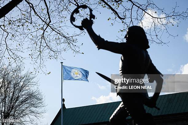 Statue of England's King Richard III is seen as a Leicester City flag flies above the Cathedral in central Leicester, eastern England, on 2 May,...