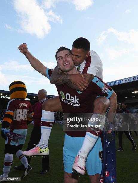 Sam Vokes and Andre Gray of Burnley celebrate as they are promoted to the Premier League after the Sky Bet Championship match between Burnley and...