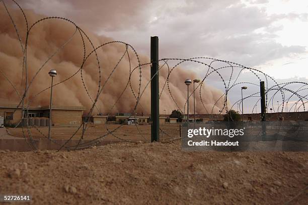 In this picture released by the U.S. Marine Corps a dust storm similar to special effects on the big screen bellowed across the western desert of...