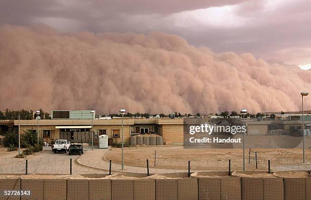 In this picture released by the U.S. Marine Corps a dust storm similar to special effects on the big screen bellowed across the western desert of...