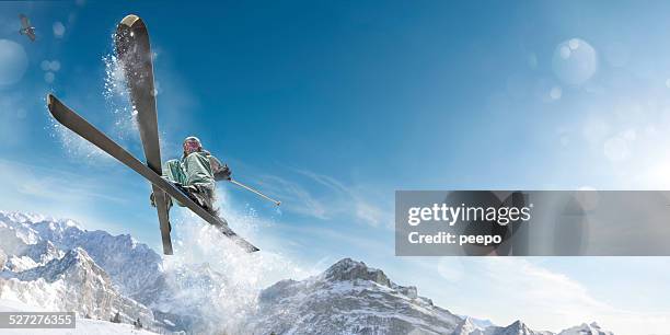 extreme skiing girl in mid air jump action - skidåkning bildbanksfoton och bilder