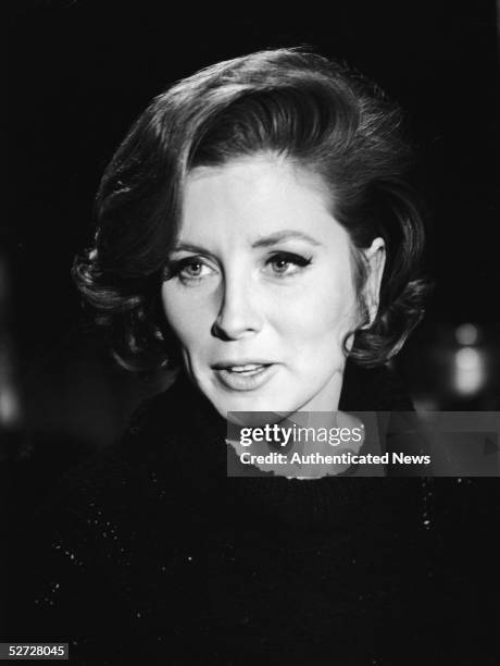 Portrait of American model and actress Suzy Parker as she speaks to someone off-camera, early 1960s.