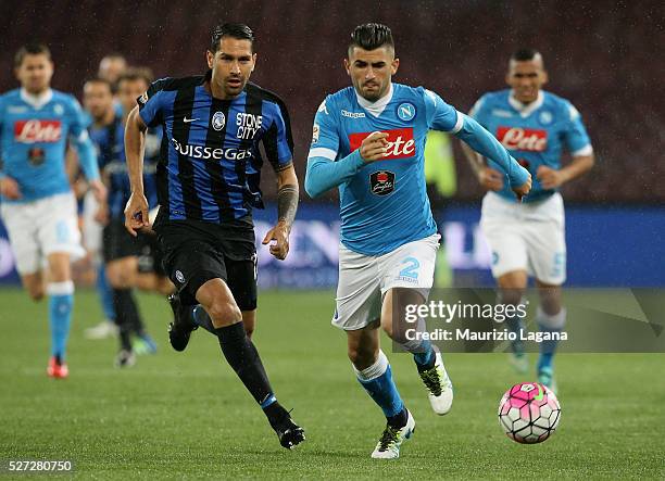 Elseid Hysaj Hamsik of Napoli competes for the ball with Marco Borriello of Atalanta during the Serie A match between SSC Napoli and Atalanta BC at...