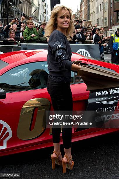 Hayley Roberts poses for photographers as Gumball Rally closes down Regent Street at Regent Street on May 3, 2016 in London, England.