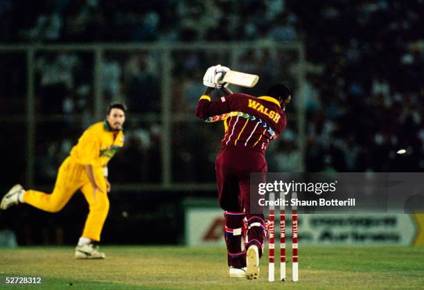 Courtney Walsh of the West Indies is bowled by Damien Fleming of Australia taking them to the final during the Cricket World Cup semi-final match...